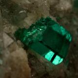 Beryl (variety emerald), Calcite, Dolomite<br />La Pita mining district, Cunas Mine, Municipio Maripí, Western Emerald Belt, Boyacá Department, Colombia<br />42x39x34mm, xls up to 7mm<br /> (Author: Fiebre Verde)