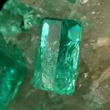 Beryl (variety emerald), Calcite, Dolomite<br />La Pita mining district, Cunas Mine, Municipio Maripí, Western Emerald Belt, Boyacá Department, Colombia<br />42x39x34mm, xls up to 7mm<br /> (Author: Fiebre Verde)