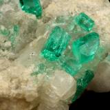 Beryl (variety emerald), Calcite, Dolomite<br />La Pita mining district, Cunas Mine, Municipio Maripí, Western Emerald Belt, Boyacá Department, Colombia<br />42x39x34mm, xls up to 7mm<br /> (Author: Fiebre Verde)