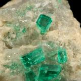 Beryl (variety emerald), Calcite, Dolomite<br />La Pita mining district, Cunas Mine, Municipio Maripí, Western Emerald Belt, Boyacá Department, Colombia<br />42x39x34mm, xls up to 7mm<br /> (Author: Fiebre Verde)