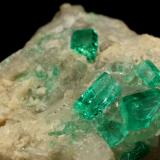 Beryl (variety emerald), Calcite, Dolomite<br />La Pita mining district, Cunas Mine, Municipio Maripí, Western Emerald Belt, Boyacá Department, Colombia<br />42x39x34mm, xls up to 7mm<br /> (Author: Fiebre Verde)