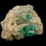 Beryl (variety emerald), Calcite, Dolomite<br />La Pita mining district, Cunas Mine, Municipio Maripí, Western Emerald Belt, Boyacá Department, Colombia<br />42x39x34mm, xls up to 7mm<br /> (Author: Fiebre Verde)