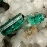 Beryl (variety emerald), Calcite<br />Muzo mining district, Western Emerald Belt, Boyacá Department, Colombia<br />130x85x100mm, xls up to 27mm<br /> (Author: Fiebre Verde)