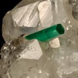 Beryl (variety emerald), Calcite<br />La Pita mining district, Polveros Mine, Municipio Maripí, Western Emerald Belt, Boyacá Department, Colombia<br />35x64x49mm, xl=12mm<br /> (Author: Fiebre Verde)