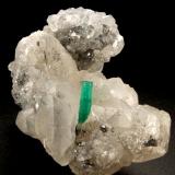 Beryl (variety emerald), Calcite<br />La Pita mining district, Polveros Mine, Municipio Maripí, Western Emerald Belt, Boyacá Department, Colombia<br />35x64x49mm, xl=12mm<br /> (Author: Fiebre Verde)