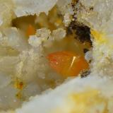 WulfenitaLabores mineras del paraje Matagallar, Coín, Comarca Valle del Guadalhorce, Málaga, Andalucía, EspañaCampo de visión de 2 mm (Autor: Antonio Carmona)