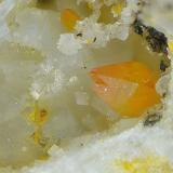 WulfenitaLabores mineras del paraje Matagallar, Coín, Comarca Valle del Guadalhorce, Málaga, Andalucía, EspañaCampo de visión de 2 mm (Autor: Antonio Carmona)