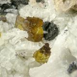 Andradite and Cuspidine<br />Shijiangshan Mine, Yinwu, Linxi, Ulanhad League, Inner Mongolia Autonomous Region, China<br />FOV 0.9 cm<br /> (Author: Cesar M. Salvan)