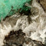 Beryl (variety emerald), Calcite, Parisite, Aragonite(?)<br />Muzo mining district, Western Emerald Belt, Boyacá Department, Colombia<br />38x40x31mm, xl=15x10mm<br /> (Author: Fiebre Verde)