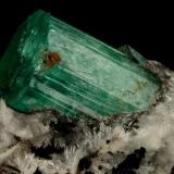 Beryl (variety emerald), Calcite, Parisite, Aragonite(?)<br />Muzo mining district, Western Emerald Belt, Boyacá Department, Colombia<br />38x40x31mm, xl=15x10mm<br /> (Author: Fiebre Verde)