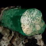 Beryl (variety emerald), Calcite, Parisite, Aragonite(?)<br />Muzo mining district, Western Emerald Belt, Boyacá Department, Colombia<br />38x40x31mm, xl=15x10mm<br /> (Author: Fiebre Verde)