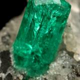 Beryl (variety emerald), Calcite<br />Chivor mining district, Municipio Chivor, Eastern Emerald Belt, Boyacá Department, Colombia<br />25x25x32mm, xl=8x3mm<br /> (Author: Fiebre Verde)