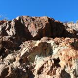 Photo 7. Sandstone rotated from near horizontal to vertical in a crush zone rich in copper oxides. (Author: crocoite)