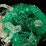 Beryl (variety emerald), Calcite, Quartz<br />Muzo mining district, Western Emerald Belt, Boyacá Department, Colombia<br />53x39mm, xl=25x23mm<br /> (Author: Fiebre Verde)