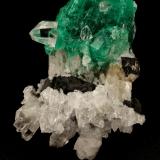 Beryl (variety emerald), Calcite, Quartz<br />Muzo mining district, Western Emerald Belt, Boyacá Department, Colombia<br />53x39mm, xl=25x23mm<br /> (Author: Fiebre Verde)