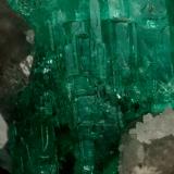 Beryl (variety emerald), Calcite, Quartz<br />La Pita mining district, Municipio Maripí, Western Emerald Belt, Boyacá Department, Colombia<br />21x35mm, cluster=20mm long<br /> (Author: Fiebre Verde)