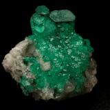 Beryl (variety emerald), Calcite<br />La Pita mining district, Cunas Mine, Municipio Maripí, Western Emerald Belt, Boyacá Department, Colombia<br />21x17x20mm, largest xl=18mm (H)<br /> (Author: Fiebre Verde)