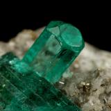 Beryl (variety emerald), Calcite, PyriteChivor (distrito minero), Municipio Chivor, Cinturón Esmeraldífero Oriental, Departamento Boyacá, Colombialargest xl=11mm (Author: Fiebre Verde)