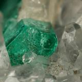 Beryl (variety emerald), Calcite<br />La Pita mining district, Cunas Mine, Municipio Maripí, Western Emerald Belt, Boyacá Department, Colombia<br />31x21x20mm, xl=16x4mm<br /> (Author: Fiebre Verde)