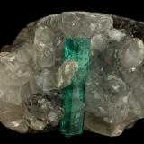 Beryl (variety emerald), Calcite<br />La Pita mining district, Cunas Mine, Municipio Maripí, Western Emerald Belt, Boyacá Department, Colombia<br />31x21x20mm, xl=16x4mm<br /> (Author: Fiebre Verde)