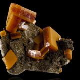 Wulfenite<br />Erupción Mine (Ahumada Mine), Los Lamentos Mountain Range, Municipio Ahumada, Chihuahua, Mexico<br />7,5	x	5,0	x	7,0	cm<br /> (Author: MIM Museum)